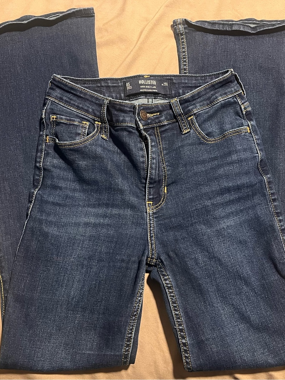Hollister High-Rise Flare Jeans in Dark Blue with Yellow Stitching